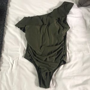 One shoulder ruffle one piece swimsuit with side ruching.